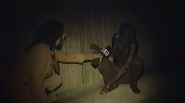 The reported kneels down to talk to someone she met in the sewer, while looking for Ratman