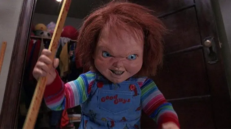 Chucky smiles while wielding a school ruler