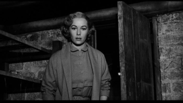 Vera Miles as Lila Crane in Psycho looks into the Bates' basement.