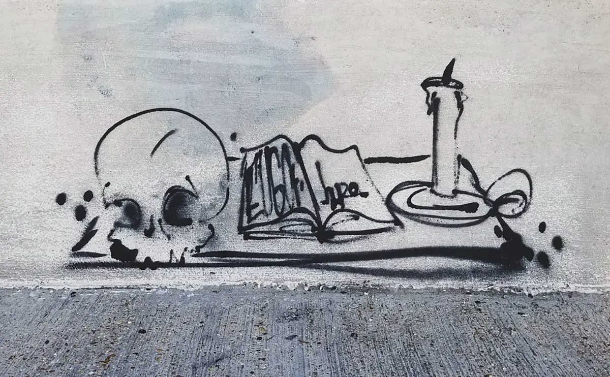 An ink drawing of a skull, book, and candle.