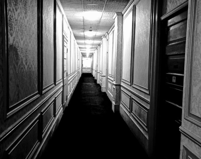 Black and white photos of the hotel hallway on the fifth floor of the Congress Plaza Hotel.