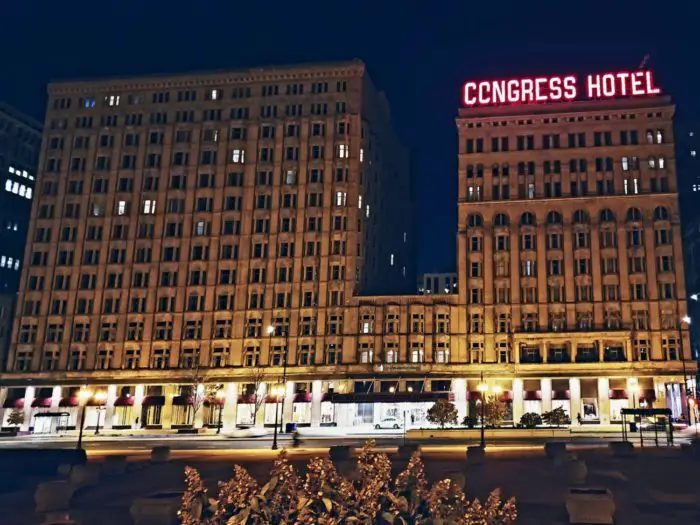 front view of the Congress Plaza Hotel with red neon letters declaring its name