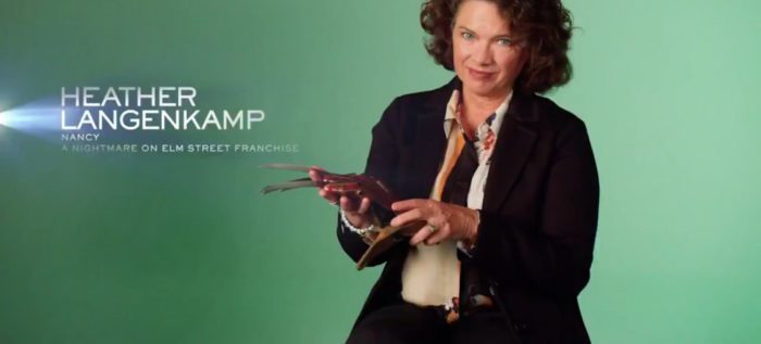 Heather Langenkamp, credited as “Nancy” for “A Nightmare on Elm Street” franchise, grins while holding Freddy Krueger’s glove in the series, "Behind the Monsters."