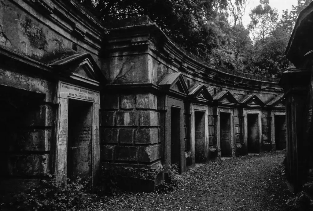 A black and white photo of mausoleums.