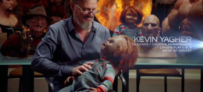 Kevin Yagher, credited as "Designer/Creator of Animatronics," holds an angry Chucky doll for his interview for the series, "Behind the Monster."