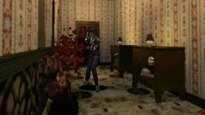 Jill Valentine shoots a zombified dog in a hallway of the Spencer Mansion. 