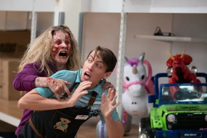 Ryan Lee as Chris Godecki, being attacked by an infected shopper in Black Friday
