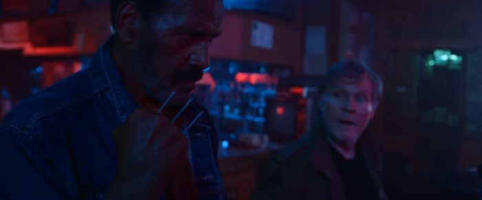 Fred Williamson puts nails between his fingers while William Sadler watches in VFW