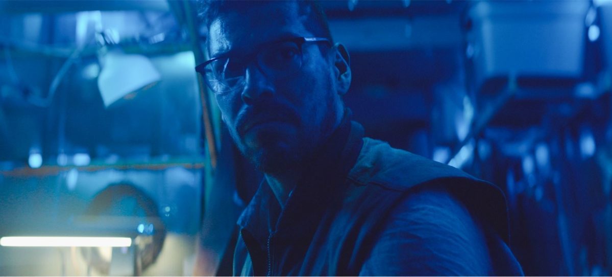 Arthur is shown with broken glasses under a blue light in Mother/Android