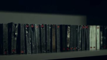 A row of damaged video cassette tapes