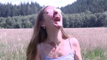 A young girl covered in blood screams in an empty field in Honeycomb