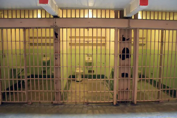 A picture of a series of empty prison cells.