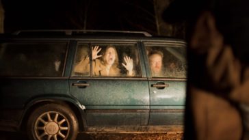 Louise presses her hands to the glass in the back seat of a station wagon as she and Bjørn look on in horror in Speak No Evil