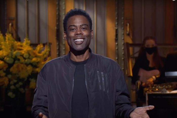 Chris Rock delivers a monologue at the opening of one of the many SNL hosting gigs he has had.