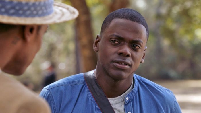 Daniel Kaluuya talks with LaKieth Stanfield when they realize they are the only black people at this weirdly white party from Jordan Peele's Get Out