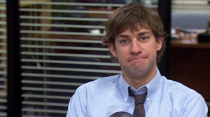 John Krasinski stares into the camera with his patented Jim look from The Office