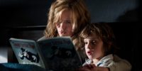 A mother reads her son a book in "The Babadook"