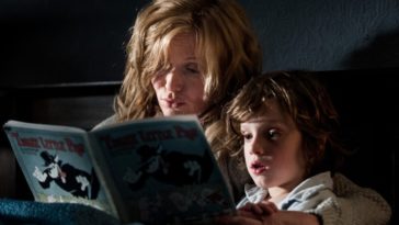 A mother reads her son a book in "The Babadook"