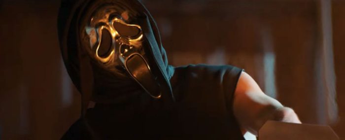 A scene from Stab 8, where Ghostface adorns a golden mask and a flamethrower