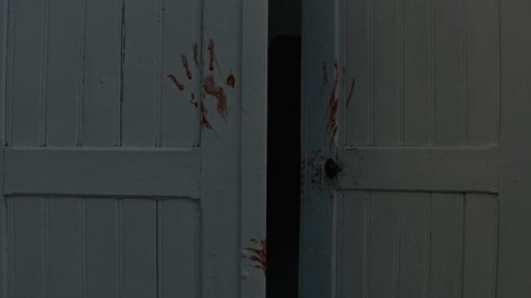 Doors with bloody handprints