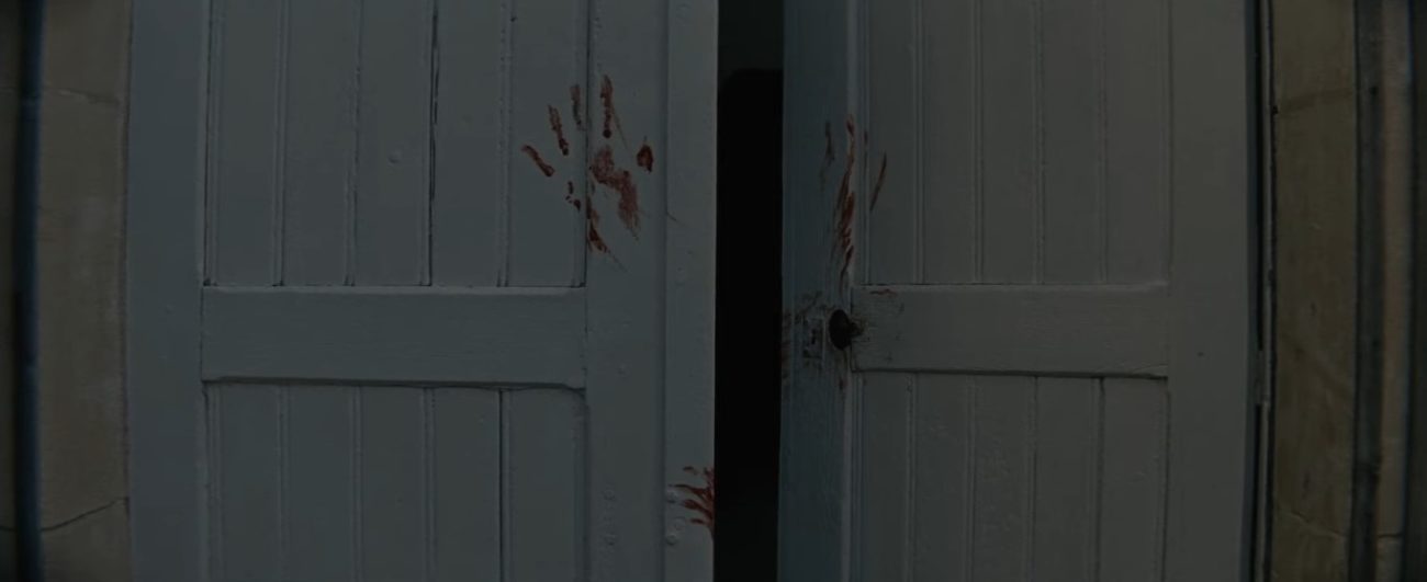 Doors with bloody handprints