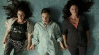 June (Lindsay Burdge), Annie (Jennifer Lafleur) and Isa (Aleksa Palladino) have a sisterly moment when they make a music video together
