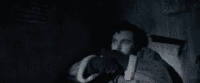 Shepherd: Eric Black (Tom Hughes) covers in fear, a knife embedded in the wall beside him