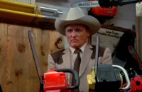 A shot from Texas Chainsaw Massacre 2, shows Lt. "Lefty" Enright (Dennis Hopper), testing out two chainsaws at the same time