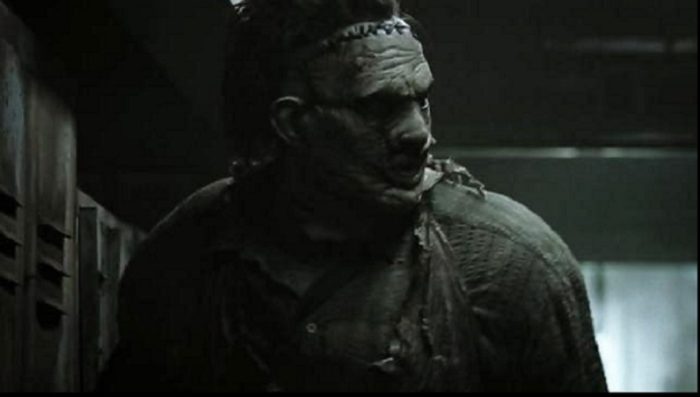 Leatherface looks off to the side of the screen