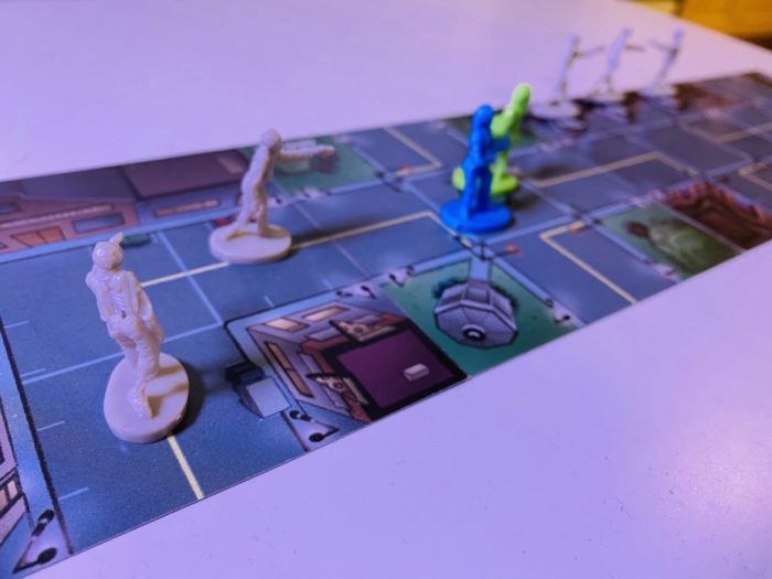 The starting move of a round of Zombies!!! where the first tile card is placed after the town square