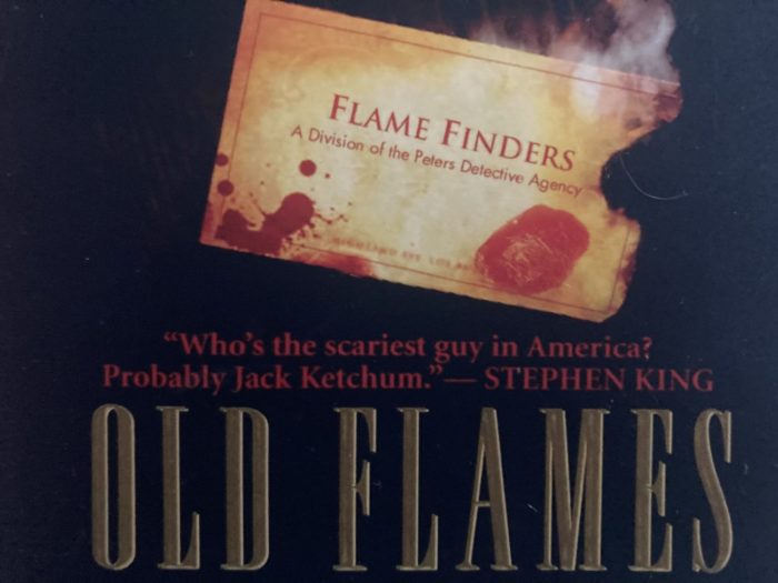 A bloody business card for "Flame Finders," a private detective agency. The title "Old Flames" is underneath