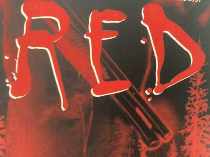 Cover for Red depicts a shotgun being held near the title