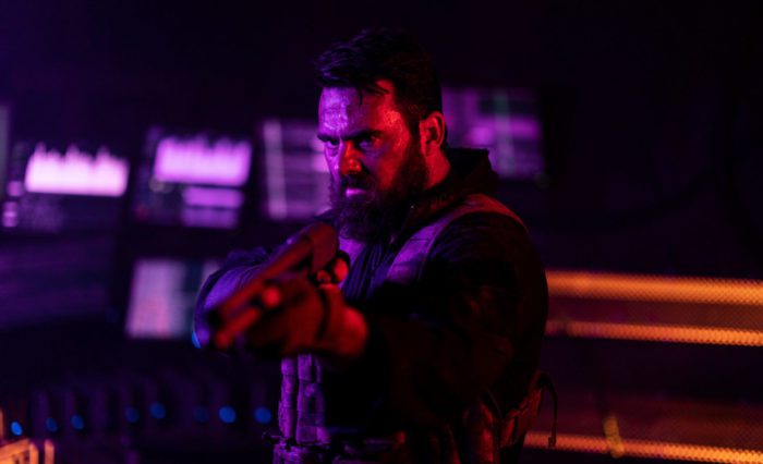 BARRY (Jay Gallagher) aims shotgun in Wyrmwood: Apocalypse