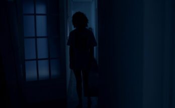 A shot from Ego shows Paloma (Maria Pedraza) shadowed through a door, face not visible