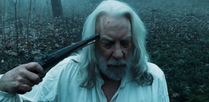 Donald Sutherland holds a gun to his head in a scene from An American Haunting