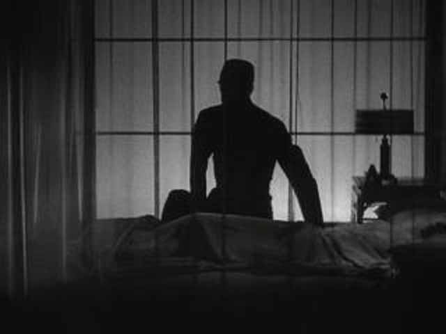 A silhouette of Hjalmar Poelzig awakening from his nightly slumber.