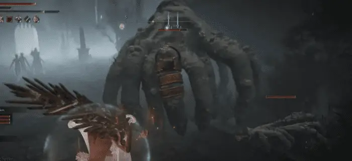 a massive spider made of human fingers attacks the player