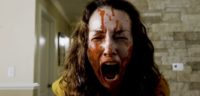 A blood-soaked woman screaming