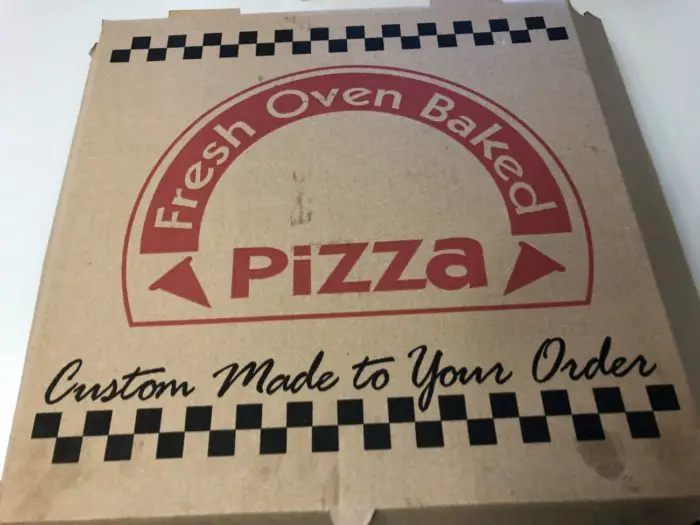 A closeup of a brown cardboard pizza box.
