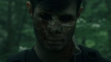 a boy's face scarred and with blackened eyes in The Long Dark Trail