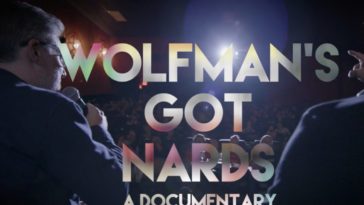 Title card for "Wolfman's Got Nards: A Documentary," superimposed over a packed movie theater.