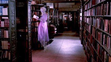 a ghost floats in a library, reading a book
