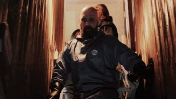 The Cleaning crew walk downstairs in 11th Hour Cleaning