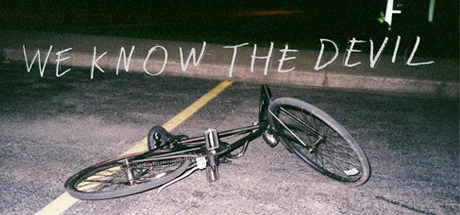a bicycle lays on its side in a parking lot