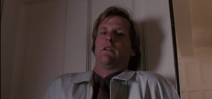 Jeff Daniels is paralyzed against a sliding door in Arachnophobia (1990)