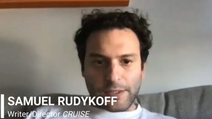 Samuel Rudykoff talks on his couch