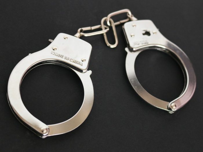 A closeup of a pair of handcuffs.