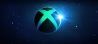 The Xbox Logo against a blue starry sky