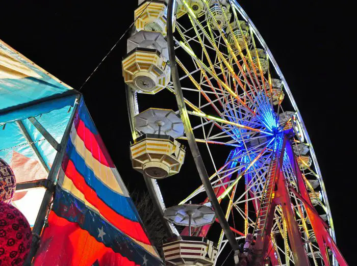 A Feris Wheel lights up the night sky