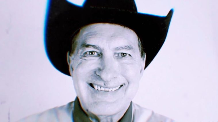 Close-up black and white of Joe Bob wearing a cowboy hat.